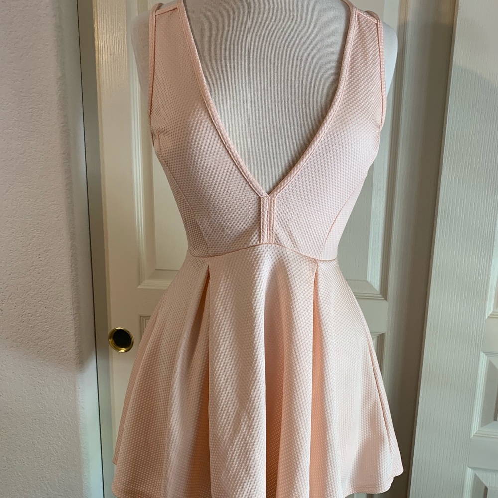 Baby pink baby doll dress with cross cross back
